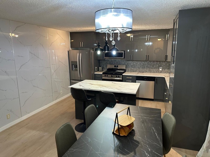 Dark island kitchen by Monarch Cabinets