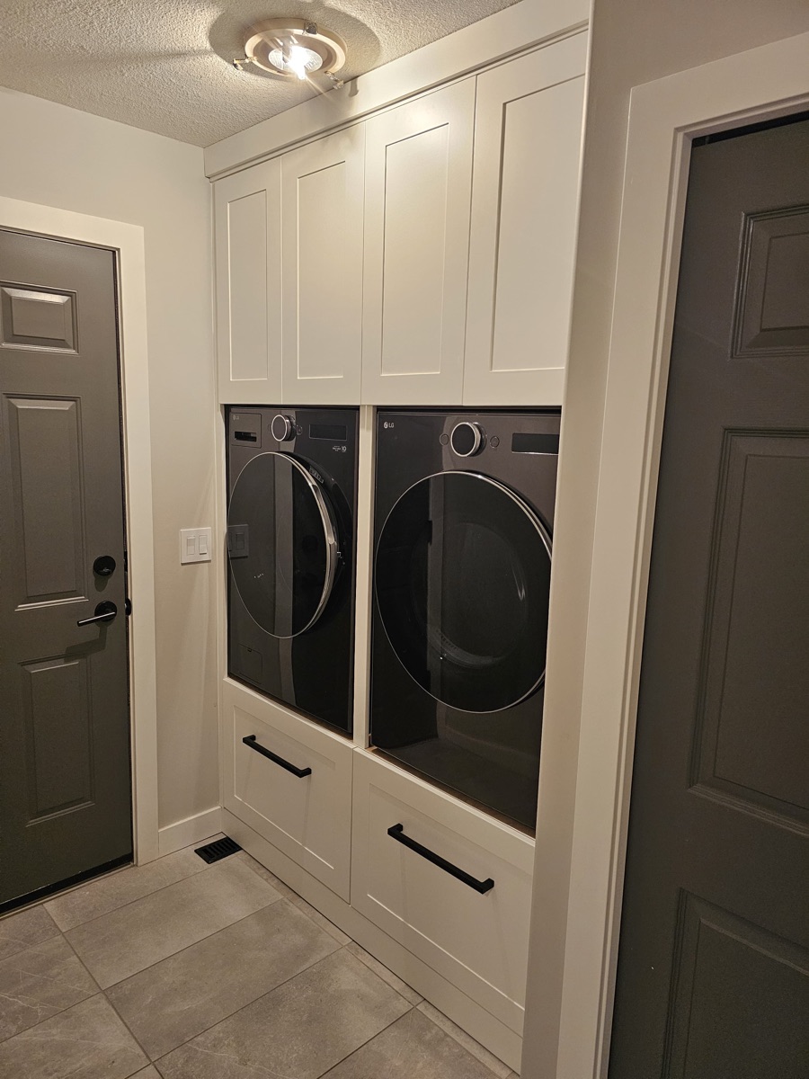 Custom white shaker laundry room cabinets Saskatoon
