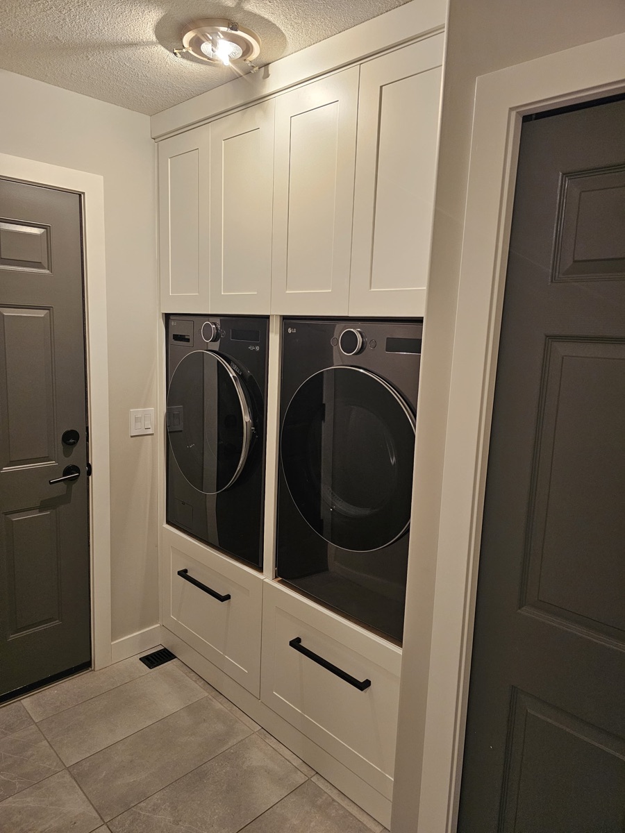 Laundry room built-in cabinets above washer and dryer, Saskatoon SK