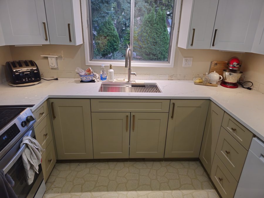 Sage green and white shaker kitchen cabinets Saskatoon